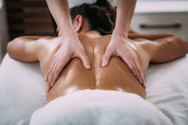 Person receiving deep tissue massage